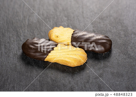Lazy cookie with chocolate on grey stone 48848323