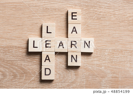 Conceptual business keywords on table with elements of game making crossword 48854199