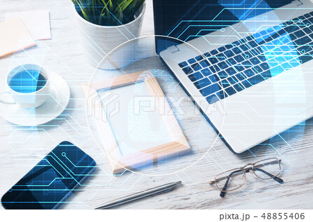 Business workplace with laptop coffee cup and security concept on screen Business workplace with laptop coffee cup and security concept on screen 48855406