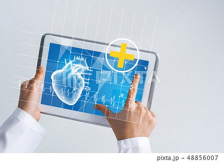 Close of female doctor hands working with tablet pc computer Close of female doctor hands working with tablet pc computer 48856007