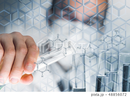 Portrait of concentrated male scientist working with reagents in laboratory 48856072