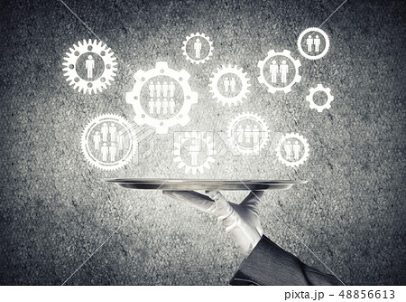 Waiter hand with white gloves holding silver plate full of social media communication icons 48856613