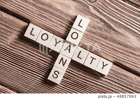 Conceptual business keywords on table with elements of game making crossword 48857063