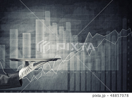 Waiter hand in white glove presenting empty tray and dynamics of diagram at background Waiter hand in white glove presenting empty tray and dynamics of diagram at background 48857078