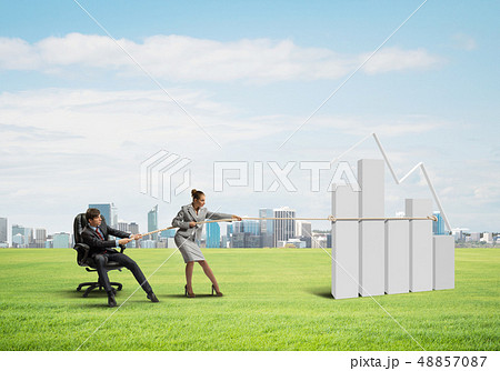 Businesspeople pulling graph with rope as symbol of power and control 48857087