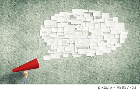 Hand of man holding red paper trumpet and speech cloud 48857753