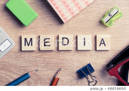 Mass media conceptual words spelled with wooden cubes on desk 48858600
