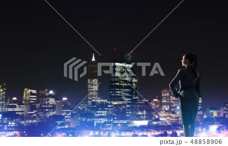 Woman looking at night city 48858906