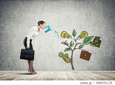 Young businesswoman in empty room watering drawn growth concept with can 48859128