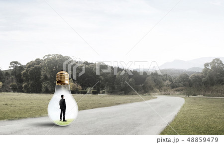 Businessman inside light bulb 48859479