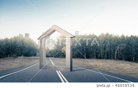 Conceptual background image of concrete home sign on asphalt roa Conceptual background image of concrete home sign on asphalt roa 48859538