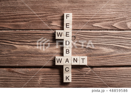 Conceptual media keywords on table with elements of game making crossword 48859586