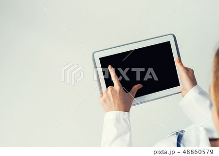 Close of female doctor hands working with tablet pc computer 48860579