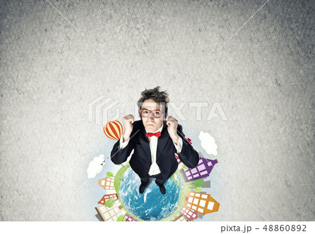 Businessman on Earth globe 48860892