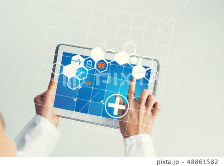 Close of female doctor hands working with tablet pc computer Close of female doctor hands working with tablet pc computer 48861582