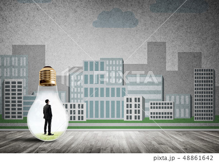 Businessman trapped in bulb 48861642