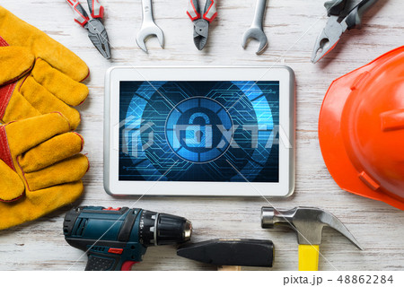 Web security and technology concept with tablet pc on wooden table 48862284