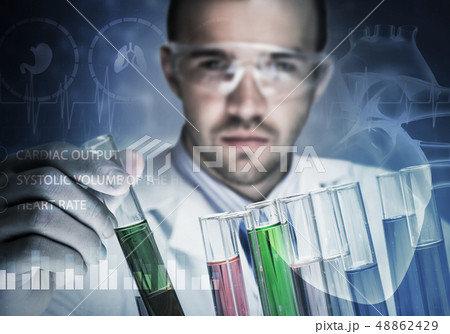 Portrait of concentrated male scientist working with reagents in laboratory 48862429