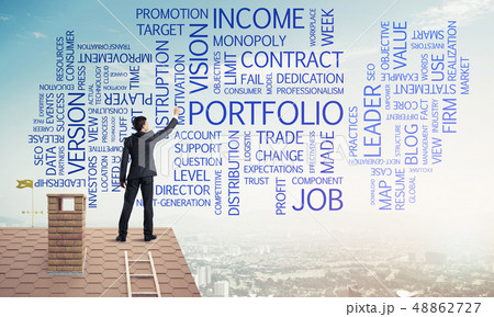 Young businessman standing on house roof and writing leadership 48862727