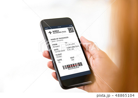 Passenger looking at electronic boarding pass on Passenger looking at electronic boarding pass on 48865104