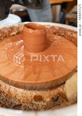 Craftsman hands making pottery bowl. Woman working on potter wheel . Family business shop sculpts 48865525
