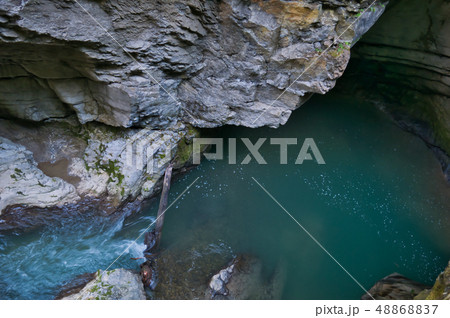 Rocks washed out by the water in the gorge 48868837