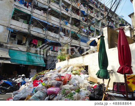 Garbage mountain in a backyard of a market place 48868864