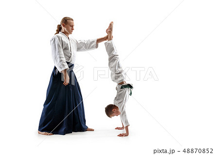 Man and teen boy fighting at aikido training in martial arts school 48870852