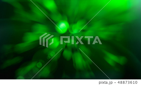 Light flare on abstract glowing light on a green background 48873610