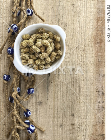 dried mulberry fruits on a wooden table decorated dried mulberry fruits on a wooden table decorated 48876282