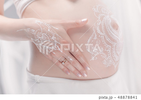 Pregnant bellypainting in boho style. Pregnant bellypainting in boho style. 48878841