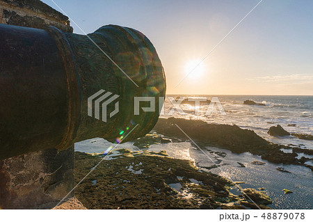 Muzzle of old Historical portugese Heavy Classical Metal Cannon In a Fortress Sunset Time at the 48879078