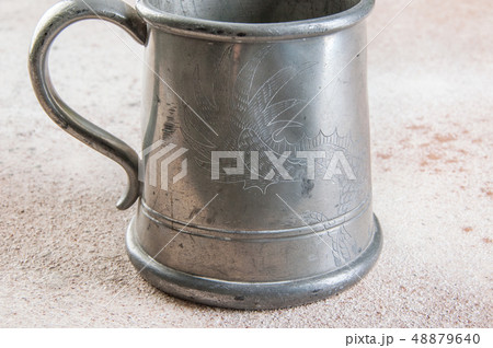Vintage pewter beer mug close up Vintage pewter beer mug close up 48879640