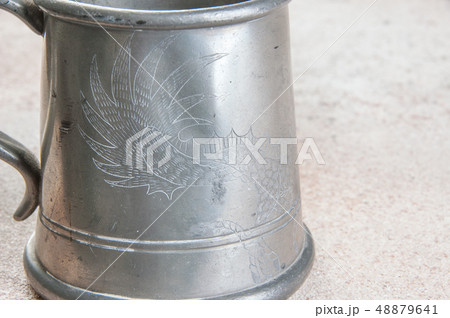 Vintage pewter beer mug close up Vintage pewter beer mug close up 48879641