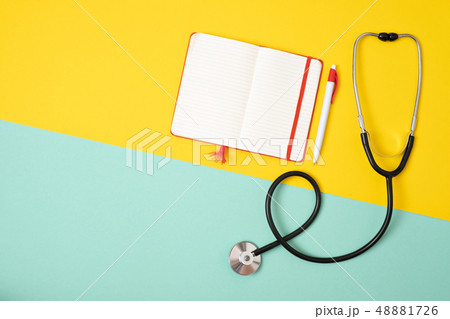 Medical phonendoscope or stethoscope isolated on yellow and blue background with copyspace. Medical phonendoscope or stethoscope isolated on yellow and blue background with copyspace. 48881726