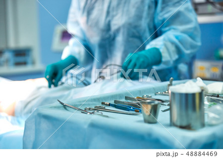 Preparation of sterile instrument for surgery. Neatly laid out instrument against the background of 48884469