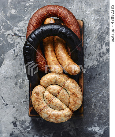 Smoked sausages on cutting board Smoked sausages on cutting board 48892285