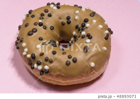 American traditional doughnut with sprinkles on a contrasting background 48893071