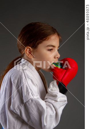 Girl with a protective mouth guard 48893073