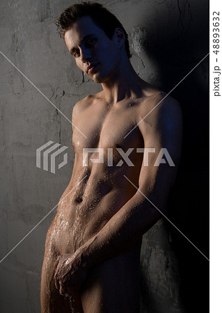 Muscular nude man after shower in the dark 48893632