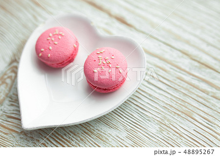 Delicious fresh macaroons on the plate 48895267