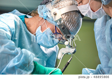 Portrait of a surgeon close-up. Surgeons operate on a patient. Tense, serious faces. Real operation 48895866