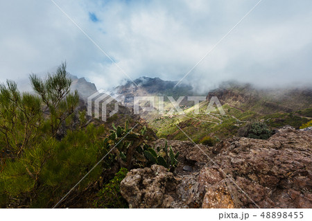 Serpentine road into fabulous Masca village in gorge most visited tourist place 48898455