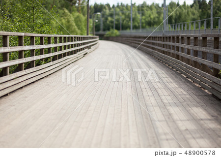 Wooden walkway bridge outdoors Wooden walkway bridge outdoors 48900578