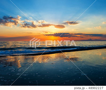 Sunset on sea beach 48902227