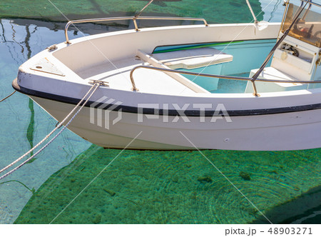 A fishing boat in Pomos harbour and crystal clear 48903271