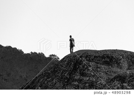 Man silhouette on rock at Meteora monastery Man silhouette on rock at Meteora monastery 48903298