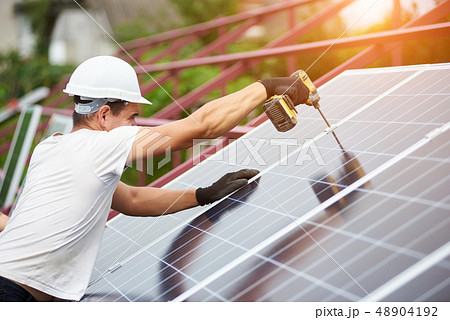 Installation of stand-alone exterior photo voltaic panels system. Renewable green energy generation. Installation of stand-alone exterior photo voltaic panels system. Renewable green energy generation. 48904192