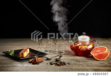 Serving sushi rolls and other traditional japanese and asian food on a table 48904367