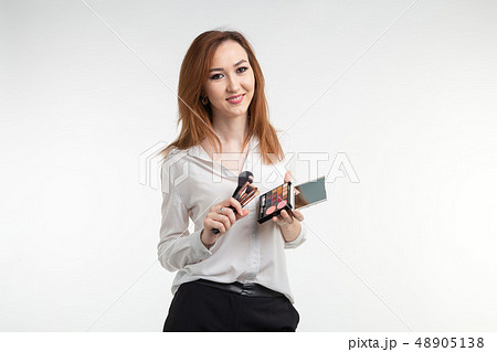 Makeup artist, beauty and cosmetics concept - Korean female make-up artist with makeup brushes and Makeup artist, beauty and cosmetics concept - Korean female make-up artist with makeup brushes and 48905138